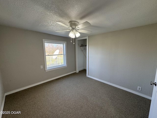 2344 US Highway 60, Pierce City, MO 65723 - unfurnished bedroom with dark colored carpet, baseboards, a closet, and a textured ceiling