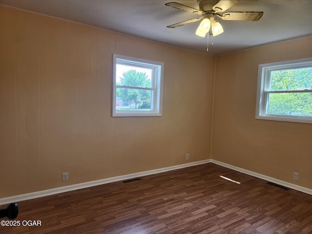 2432 S Florida, Joplin, MO 64804 - unfurnished room featuring dark wood finished floors, baseboards, and a ceiling fan