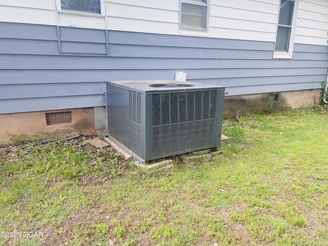 1005 E 13th St, Carthage, MO 64836 - exterior view of central AC and crawl space
