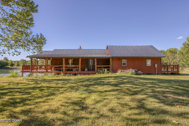 4850 S Chapel Rd, Carthage, MO 64836 - rear view of house with a yard and metal roof