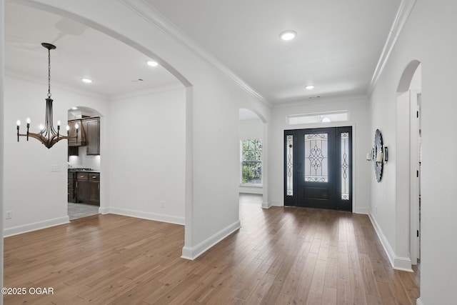 104 Van Dusen Dr, Carl Junction, MO 64834 - entrance foyer with a chandelier, wood-type flooring, recessed lighting, baseboards, and crown molding