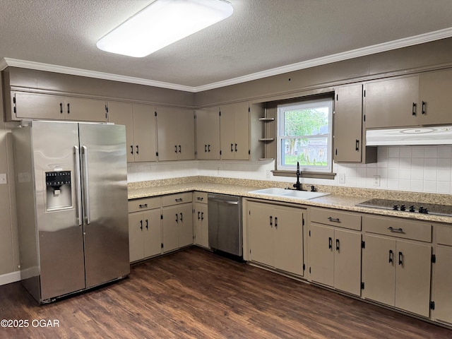 2119 S Main St, Carthage, MO 64836 - kitchen featuring appliances with stainless steel finishes, a sink, under cabinet range hood, crown molding, and dark wood-style floors