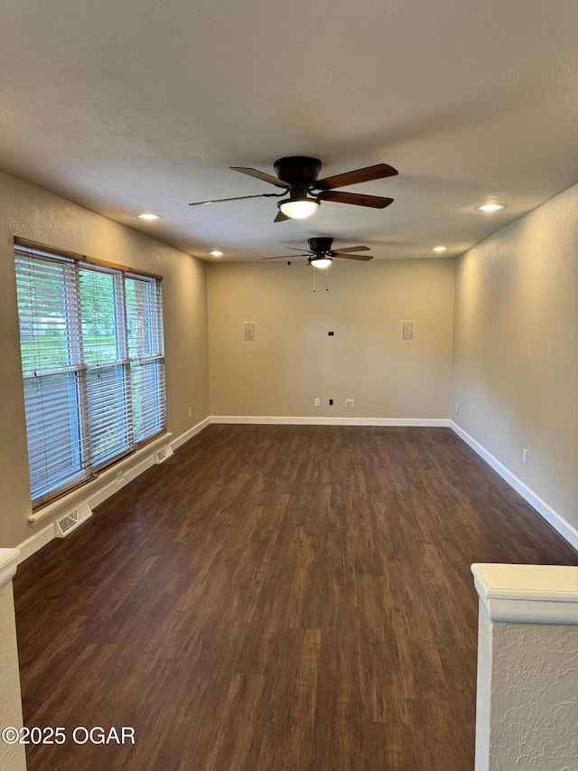 2119 S Main St, Carthage, MO 64836 - spare room featuring a ceiling fan, dark wood-style floors, baseboards, and recessed lighting