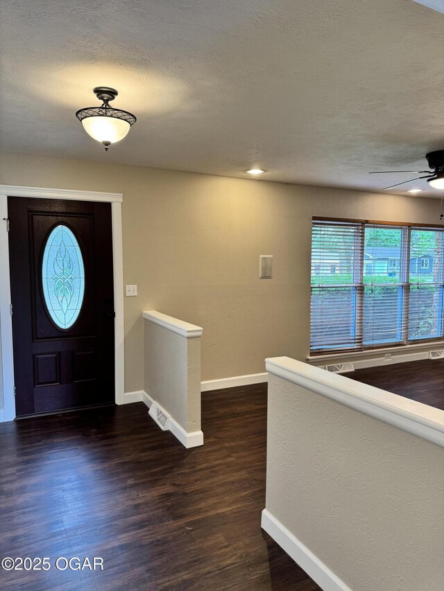 2119 S Main St, Carthage, MO 64836 - entryway with baseboards, a ceiling fan, healthy amount of natural light, and a textured ceiling
