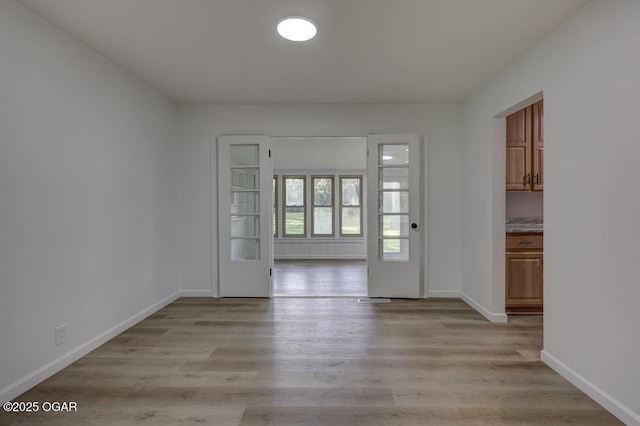 328 E 33rd St, Joplin, MO 64804 - spare room featuring light wood finished floors and baseboards