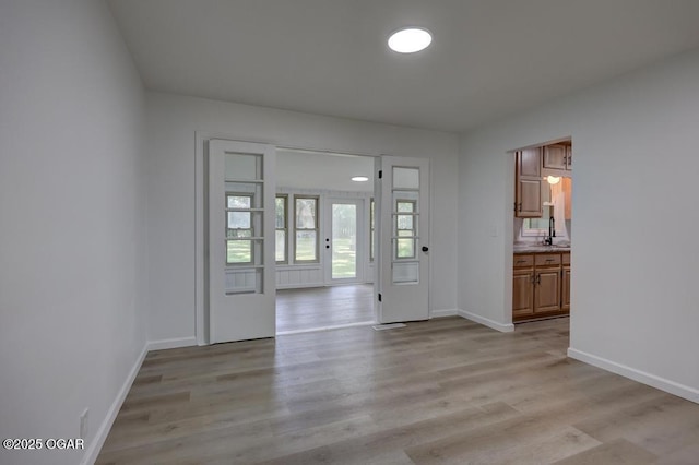 328 E 33rd St, Joplin, MO 64804 - foyer with light wood-style flooring and baseboards