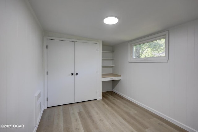 328 E 33rd St, Joplin, MO 64804 - unfurnished bedroom featuring light wood-type flooring, a closet, and baseboards