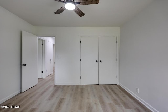 328 E 33rd St, Joplin, MO 64804 - unfurnished bedroom featuring light wood-style floors, baseboards, a closet, and a ceiling fan