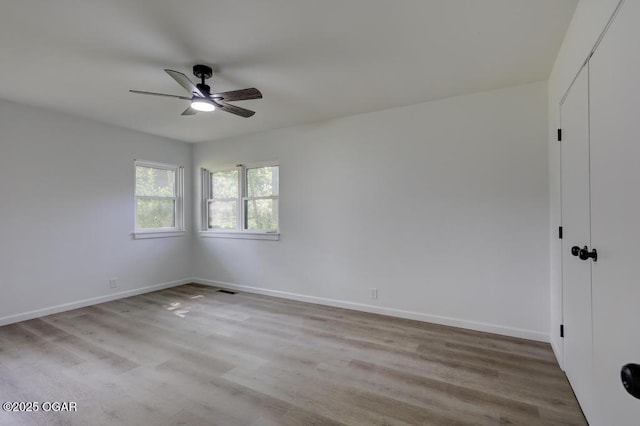 328 E 33rd St, Joplin, MO 64804 - unfurnished room featuring a ceiling fan, wood finished floors, and baseboards