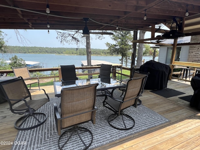 21937 Lake Rd Unit M-12, Cassville, MO 65625 - wooden deck with outdoor dining area, a water view, and grilling area