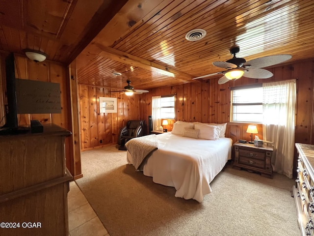 21937 Lake Rd Unit M-12, Cassville, MO 65625 - bedroom featuring multiple windows, wood walls, light carpet, a ceiling fan, and light tile patterned flooring