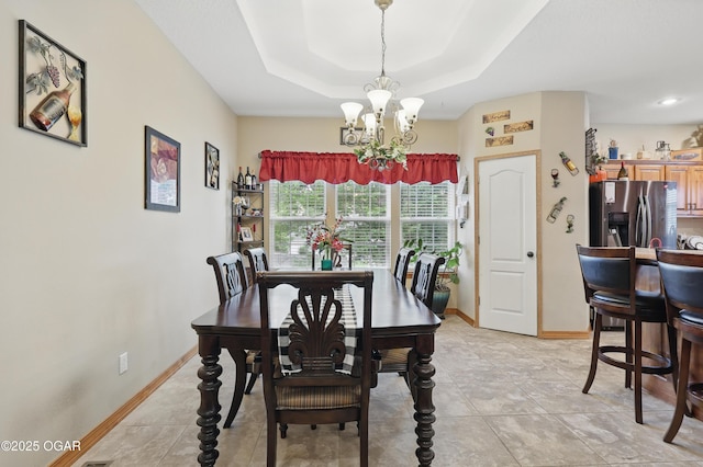 702 Copper Oaks Dr, Carl Junction, MO 64834 - dining space with a chandelier, baseboards, and a raised ceiling