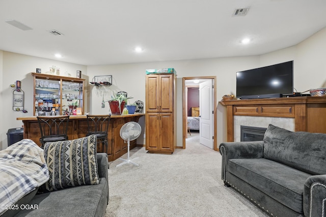 702 Copper Oaks Dr, Carl Junction, MO 64834 - living room with a bar, light colored carpet, recessed lighting, and a fireplace