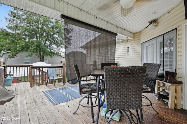 702 Copper Oaks Dr, Carl Junction, MO 64834 - wooden terrace with outdoor dining area