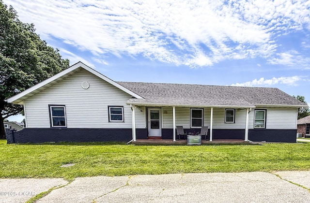 706 E Centennial E, Centennial, Pittsburg, KS 66762 - single story home with covered porch, a front lawn, and roof with shingles