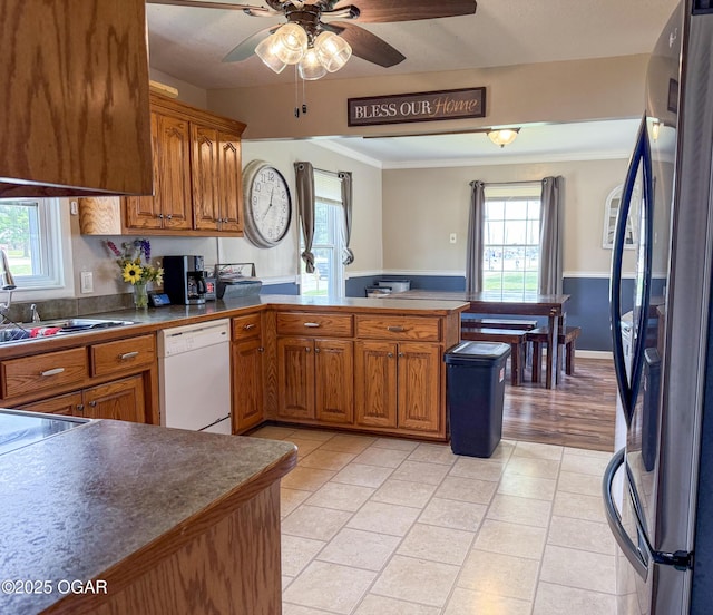 706 E Centennial E, Centennial, Pittsburg, KS 66762 - kitchen featuring freestanding refrigerator, white dishwasher, a peninsula, crown molding, and brown cabinets