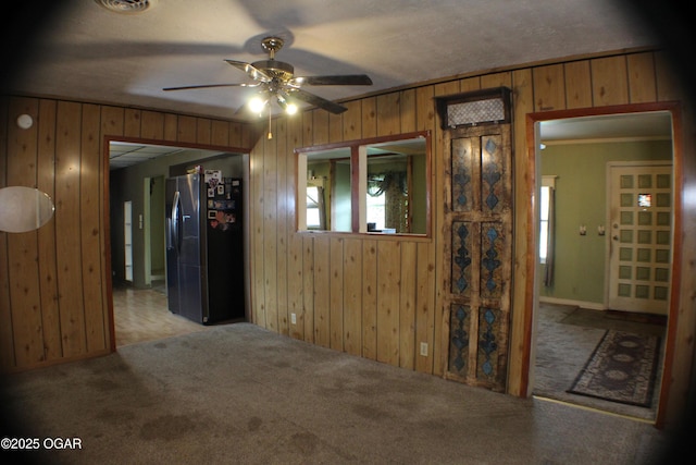423 Mower St, Duenweg, MO 64841 - carpeted empty room with ceiling fan, wooden walls, and ornamental molding