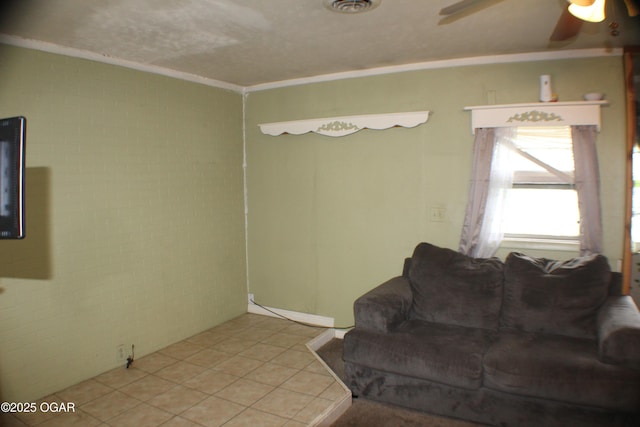 423 Mower St, Duenweg, MO 64841 - living area featuring tile patterned floors, ceiling fan, and crown molding