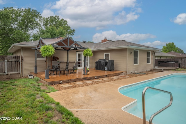 3431 Hawthorn Dr, Joplin, MO 64804 - rear view of house with a wooden deck, a hot tub, outdoor dining space, and a chimney
