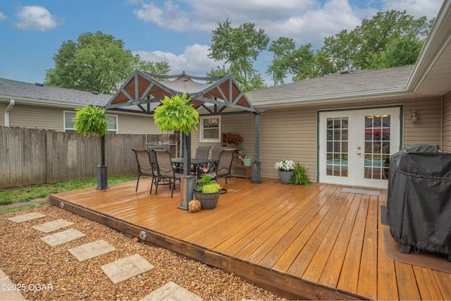 3431 Hawthorn Dr, Joplin, MO 64804 - wooden deck featuring french doors, outdoor dining area, and area for grilling