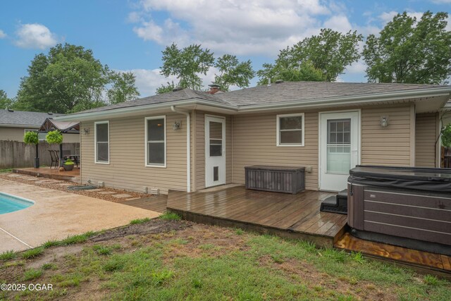 3431 Hawthorn Dr, Joplin, MO 64804 - rear view of house with a hot tub, a wooden deck, and a patio