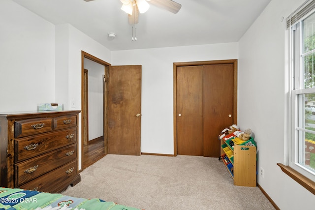 3431 Hawthorn Dr, Joplin, MO 64804 - carpeted bedroom featuring a closet, multiple windows, a ceiling fan, and baseboards