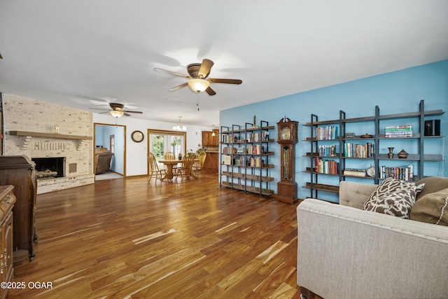 3431 Hawthorn Dr, Joplin, MO 64804 - living area with a ceiling fan, wood finished floors, and a fireplace