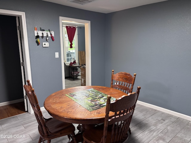 324 W Hill St, Neosho, MO 64850 - dining space featuring light wood-type flooring and baseboards