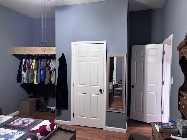324 W Hill St, Neosho, MO 64850 - bedroom featuring wood finished floors and baseboards