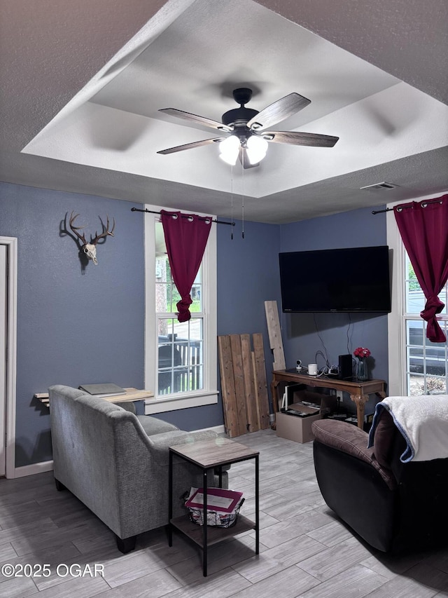 324 W Hill St, Neosho, MO 64850 - living room featuring wood finished floors and ceiling fan
