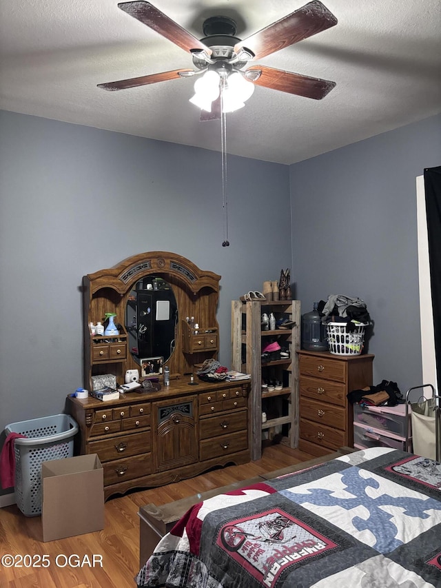 324 W Hill St, Neosho, MO 64850 - bedroom with wood finished floors and a ceiling fan