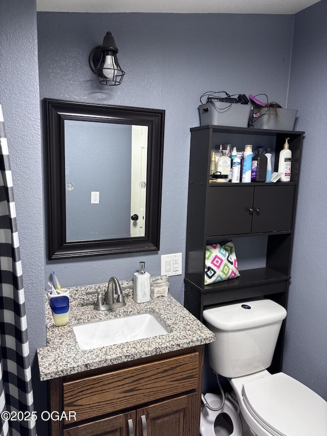 324 W Hill St, Neosho, MO 64850 - bathroom with toilet and vanity