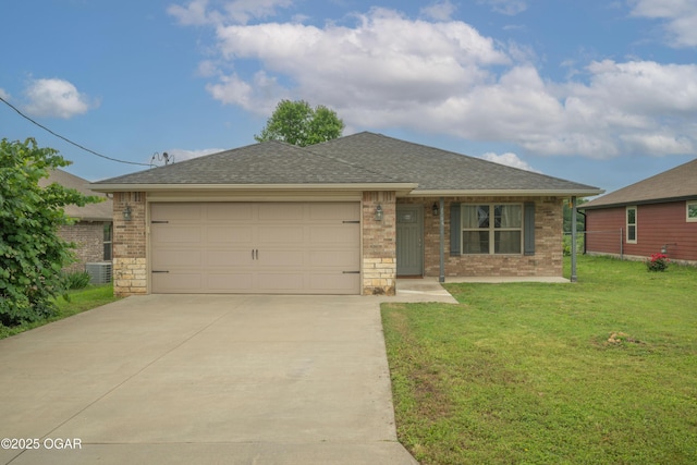 1704 Texas Ave, Joplin, MO 64804 - view of front facade with driveway, an attached garage, a front lawn, brick siding, and roof with shingles