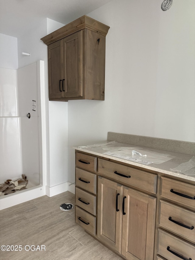 2006 E Quincy St, Joplin, MO 64801 - kitchen featuring light stone counters and light wood-type flooring