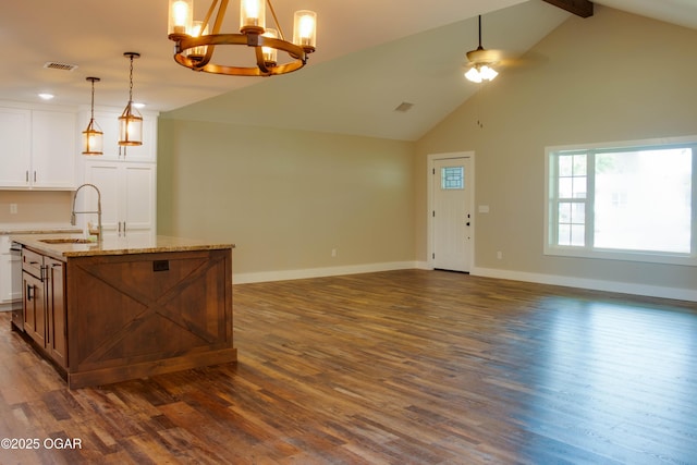 1002 S Mill St, Grove, OK 74344 - kitchen with a sink, open floor plan, a center island with sink, a chandelier, and high vaulted ceiling