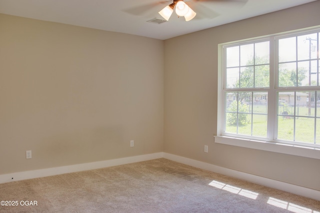 1002 S Mill St, Grove, OK 74344 - carpeted empty room featuring ceiling fan and baseboards