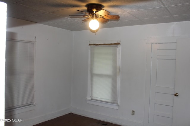 1417 S Jackson Ave, Joplin, MO 64804 - spare room with a ceiling fan, baseboards, and a drop ceiling