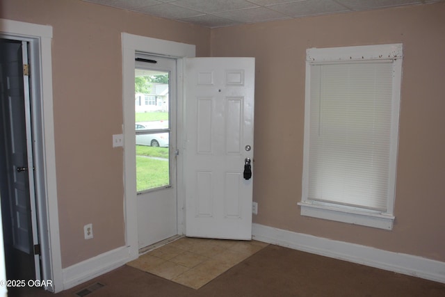 1417 S Jackson Ave, Joplin, MO 64804 - entryway featuring baseboards and light tile patterned flooring