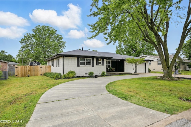 2722 Wisconsin Ave, Joplin, MO 64804 - single story home with curved driveway, brick siding, central AC, a garage, and a gate