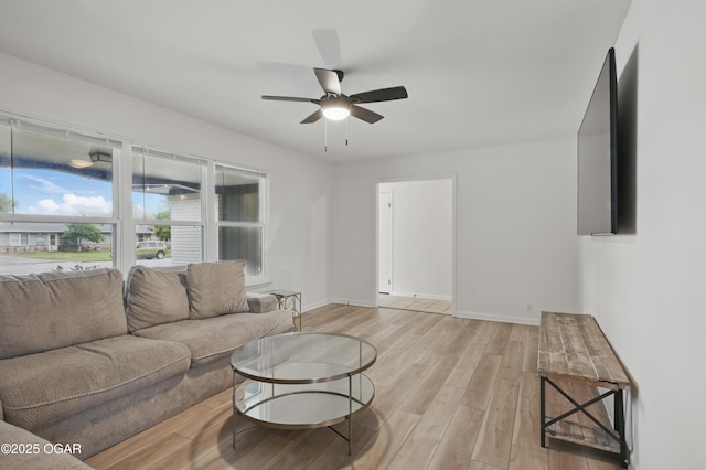 2722 Wisconsin Ave, Joplin, MO 64804 - living area with light wood-style flooring, ceiling fan, and baseboards