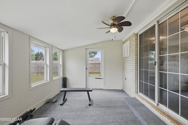 2722 Wisconsin Ave, Joplin, MO 64804 - unfurnished sunroom with brick wall, carpet flooring, ceiling fan, and lofted ceiling