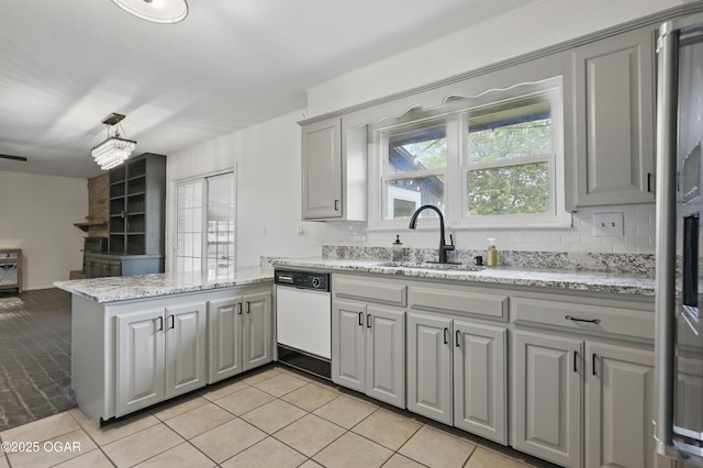 2722 Wisconsin Ave, Joplin, MO 64804 - kitchen with dishwasher, a sink, gray cabinets, and a peninsula