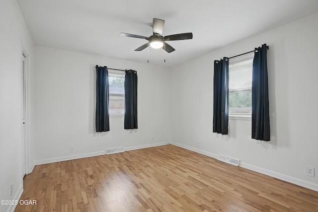 2722 Wisconsin Ave, Joplin, MO 64804 - spare room featuring light wood finished floors, a ceiling fan, and baseboards