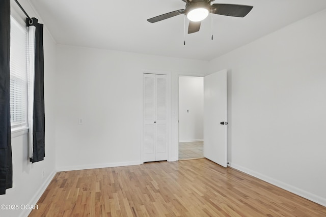 2722 Wisconsin Ave, Joplin, MO 64804 - unfurnished room with light wood-style flooring, a ceiling fan, and baseboards