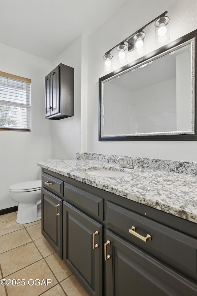 2722 Wisconsin Ave, Joplin, MO 64804 - bathroom with vanity, toilet, and tile patterned flooring