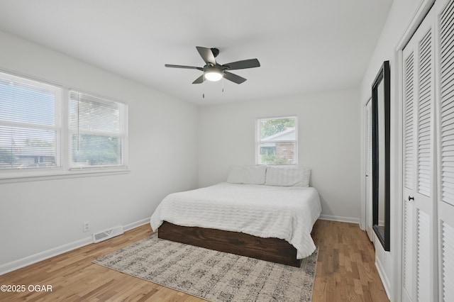 2722 Wisconsin Ave, Joplin, MO 64804 - bedroom featuring wood finished floors, baseboards, a closet, and ceiling fan
