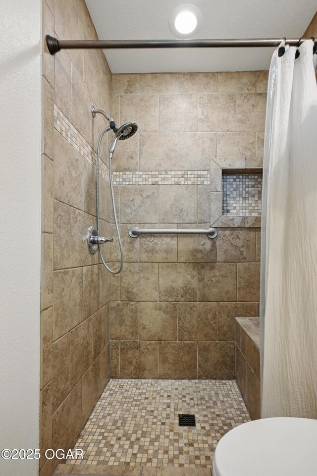 2722 Wisconsin Ave, Joplin, MO 64804 - bathroom featuring a tile shower and toilet