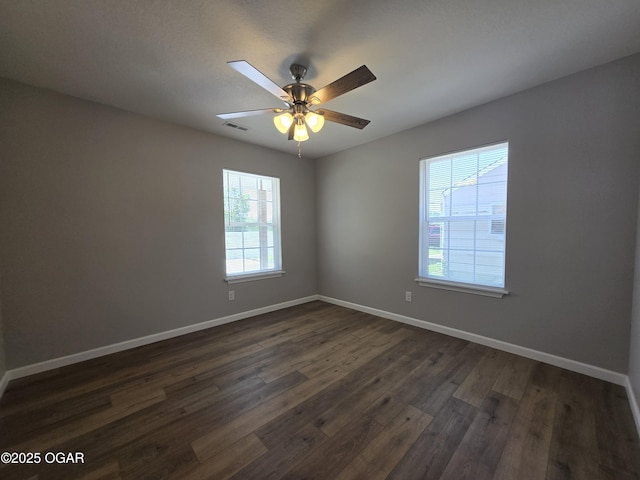 504 S Mckinley Ave, Joplin, MO 64801 - spare room with dark wood finished floors, baseboards, and ceiling fan