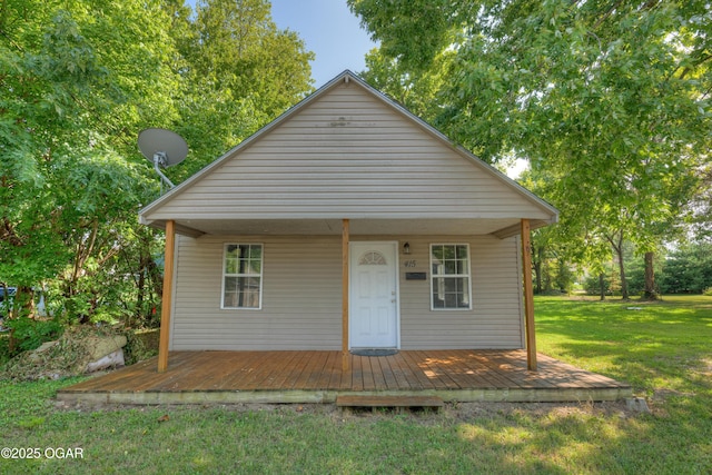 415 Adams St, Neosho, MO 64850 - bungalow-style home featuring a front lawn