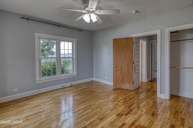 2502 S Tyler Ave, Joplin, MO 64804 - unfurnished bedroom featuring light wood-type flooring, baseboards, and a ceiling fan